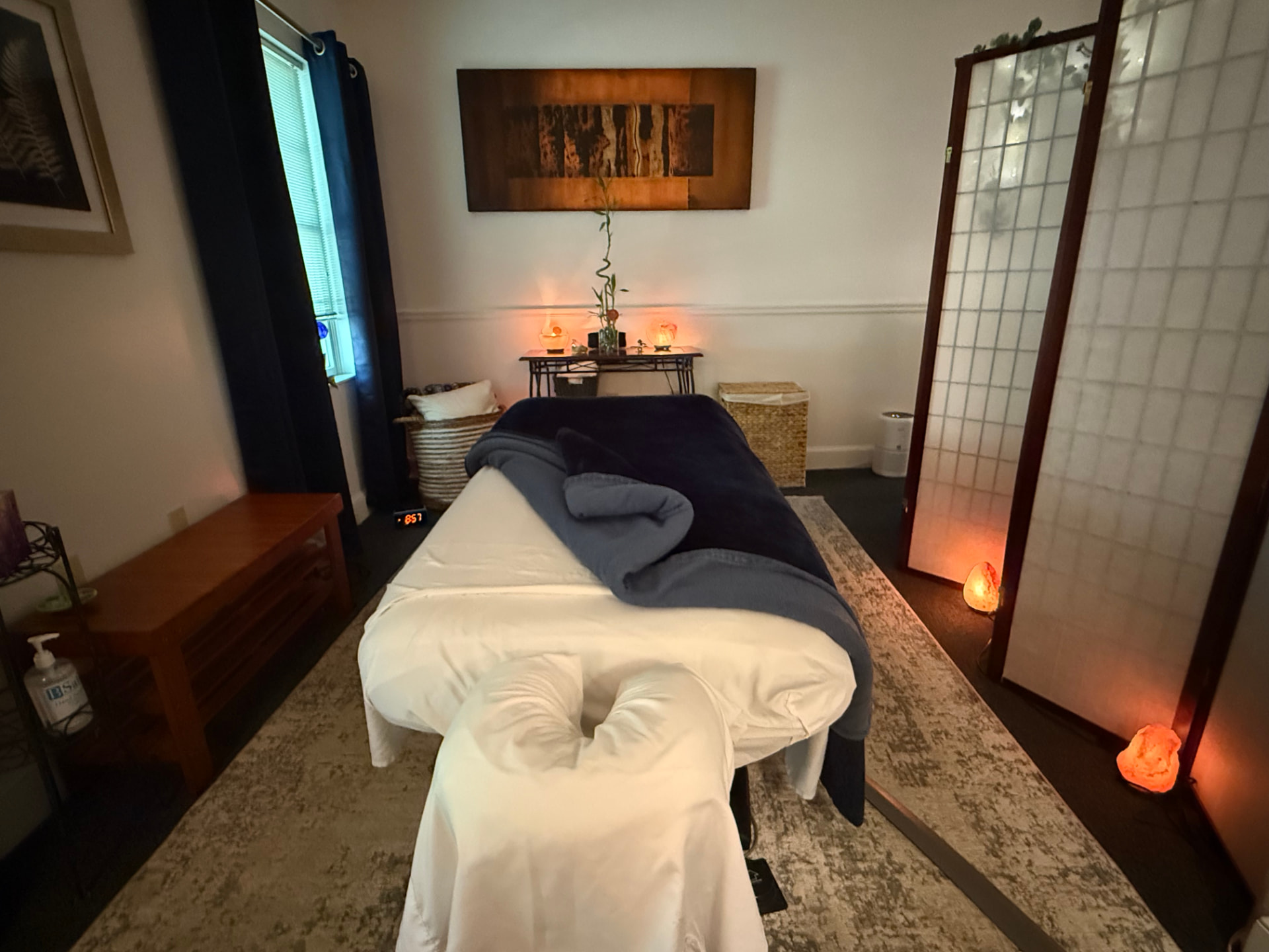 Massage table ready with warm blankets in the Westford treatment room