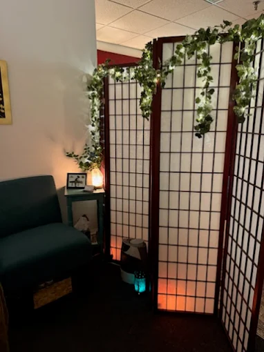 Calm waiting area with shoji screen and salt lamp at Healing Hands of Westford